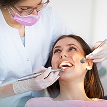 Woman receiving professional teeth cleaning