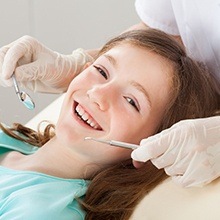 Smiling young girl at dental office
