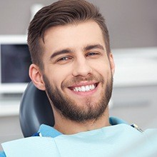 Smiling man in dental chair