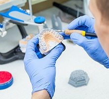 Lap technician making dentures