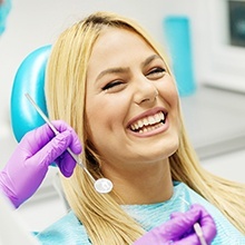 Woman laughing in dental chair