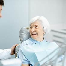 Older woman smiling with an implant dentist in Virginia Beach