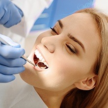 Woman receiving dental treatment