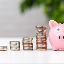 Piggy bank next to quarters