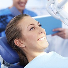 Woman in dental chair smiling