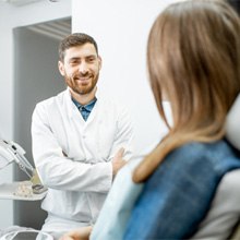 dentist explaining STABILI-TEETH™ to patient 