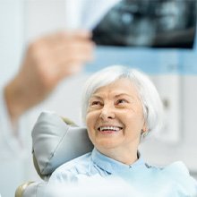 patient talking to dentist about STABILI-TEETH™ 