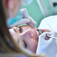 Woman receiving dental treatment