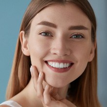 Woman smiling after cost of teeth whitening in Virginia Beach