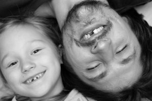 Father and daughter smiling with missing teeth. Get tooth loss facts from your Virginia Beach Dentist.