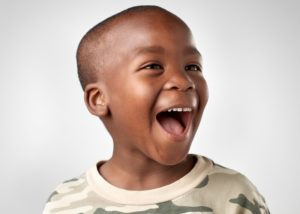 Smiling young boy excited to see his family dentist in Virginia Beach