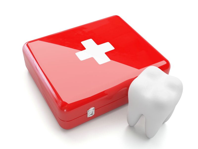 3D tooth next to first aid box