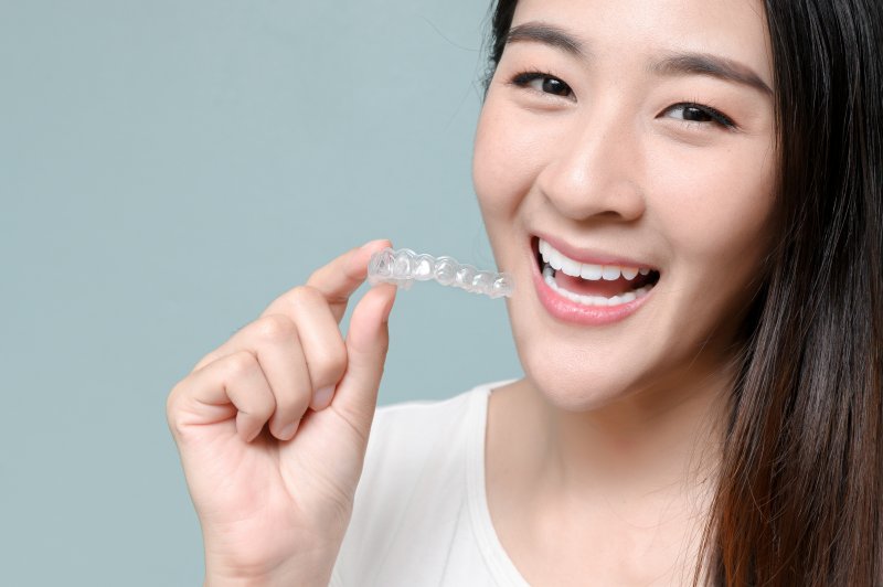 girl wearing Invisalign retainers